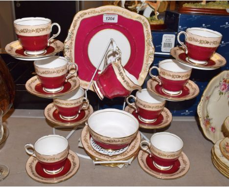 A Paragon tea service for eight comprising bread plate, side plates, cream jug, sugar basin, side plates, cups and saucers