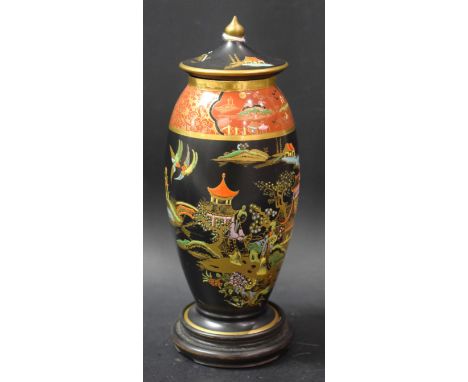 A Carlton ware Chinoiserie vase and cover on hardwood stand