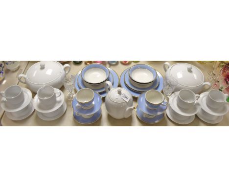 A pair of white glazed modern vegetable dishes and covers, similar teapot and eight cups and saucers; a four place Doulton br