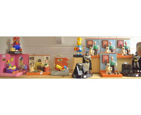 A Novelty Batman alarm clock;  others Wallace & Gromit;  the Simpsons etc qty