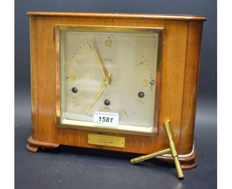 An Art Deco style Elliott oak mantel clock, W.A. Perry & co of Birmingham, presented for long service by Courtlands to George
