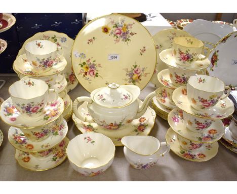 A Royal Crown Derby Posies tea service for twelve comprising bread and butter plates, a cake platter, teapot, cream jug, suga