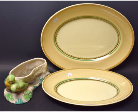 A Clarice Cliff birds planter; two oval meat plates (3)