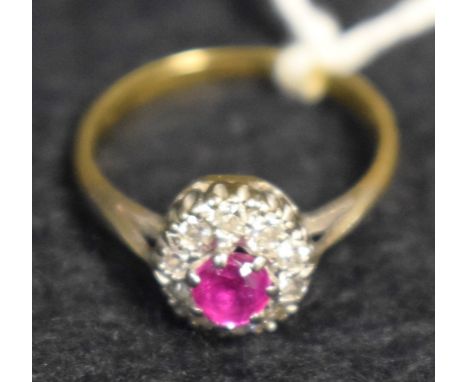 A lady's ruby and diamond cluster ring, 18ct gold shank