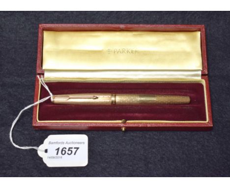 A Parker 61 Presidential 9 carat gold fountain pen, with engine turned Waterdrop pattern decoration throughout, vacant reserv