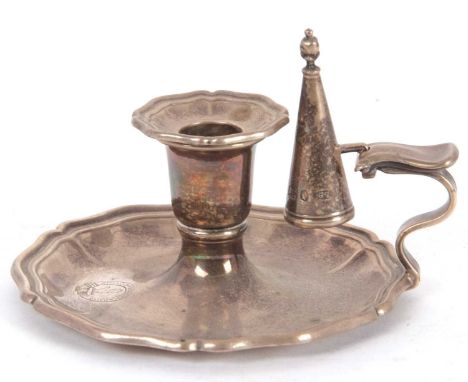 A William IV small silver chamber stick, candle holder and snuffer, having shaped borders and a conical shaped snuffer, engra