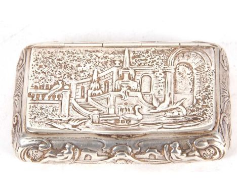 A continental silver snuff box of rectangular form, the hinged lid decorated with peacocks in a garden scene, the sides with 