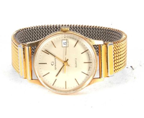 A 9ct gold cased Garrard quartz wristwatch, stamped on the inside of the case back 375, it has a white dial with gold coloure