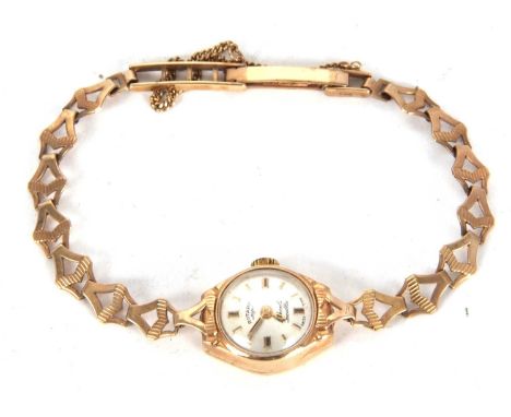 A 9ct gold cased Rotary lady's wristwatch on a 9ct gold bracelet, it has a 17 jewel crown wound movement, silver coloured dia