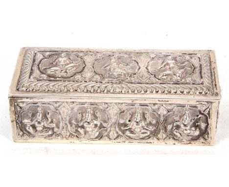 An antique Burmese white metal trinket box circa 1890 of rectangular form, the hinged lid having embossed and chased scenes d