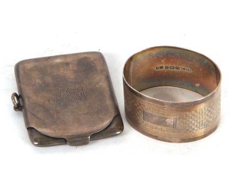 Mixed Lot: A boxed George VI silver serviette ring of oval shape, engine turned band around a plain cartouche, Birmingham 193