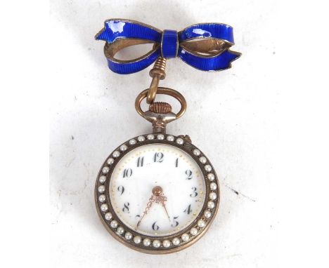 A seed pearl and enamel pocket watch with enamel bow pin, the inside of the case back is stamped 0.800 , white enamel dial wi