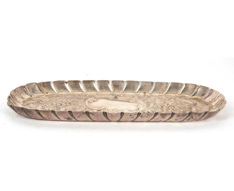 A Victorian silver trinket tray of rectangular form with crimped border, embossed and chased with foliate scrolls and flowers