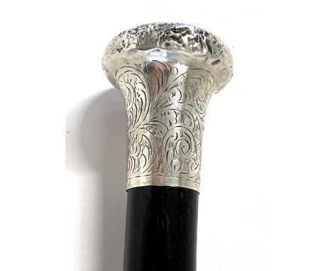Vintage silver topped walking stick cane, circa 1900 having a chased and engraved detail to collar with a black painted shaft