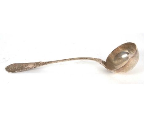 A 19th Century German silver soup or punch ladle having a decorative scroll shell and bead handle, a tapering stem to a circu