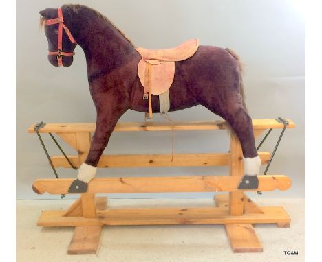 A full size child's galloping rocking horse complete with saddle 130 x 140 x 40cm
