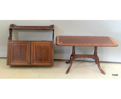 A mahogany inlaid wall cupboard with one shelf and a mahogany inlaid coffee table