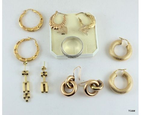 A collection of gold earrings untested with a silver set of earrings and a Hadson lighter 22 grams in weight