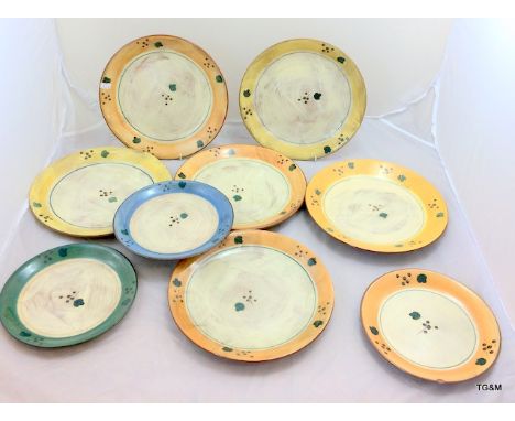 A collection of Poole pottery dinner and side plates Terracotta by Rachel Barker