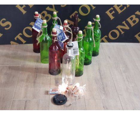 A LARGE QUANTITY OF DECORATIVE LIGHT UP BATTERY POWERED WINE BOTTLES