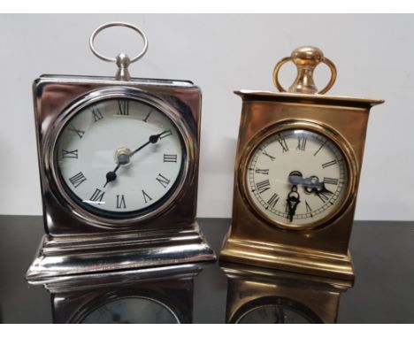 HEAVY BRASS QUARTZ TRAVELLING CLOCK WITH A PLATED SIMILAR CLOCK