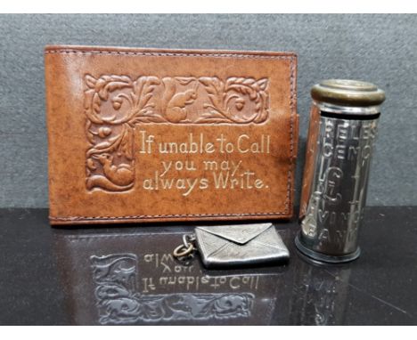 STERLING SILVER STAMPED STAMP ENVELOPE TOGETHER WITH LEATHER STAMP HOLDER AND 1POUND SAVINGS BANK MONEY BOX FOR SIXPENCES