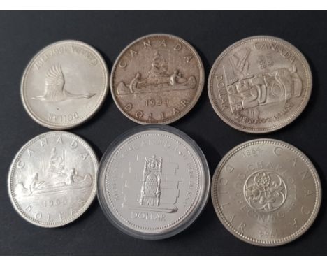 6 CANADIAN COINS SILVER 1 DOLLAR COINS DATED 1958, 59, 64, 65, 67 AND 77