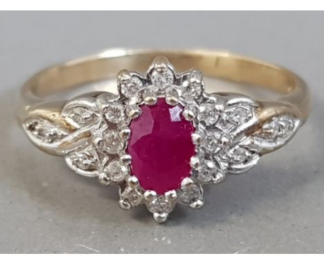 9CT YELLOW GOLD RUBY AND DIAMOND CLUSTER RING APPROXIMATELY. 15CT 2.8G SIZE R