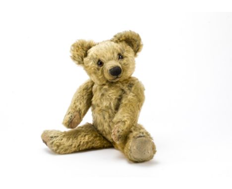 A Chad Valley teddy bear 1930s,  With golden mohair, orange and black glass eyes, pronounced muzzle, black stitched nose, mou