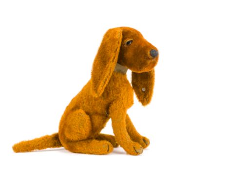 A rare Steiff cinnamon mohair Treff dog,  Seated with brown and black glass eyes inserted into heavy eye lids, black stitched