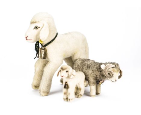 Three post-war Steiff sheep, A Wotan Ram with chest tag —9¼in. (23.5cm.) long; a large and small Lamby Lamb both with button 