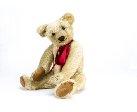 A large Chad Valley teddy late 1920s, With light golden mohair, orange and black glass eyes, pronounced clipped muzzle, black