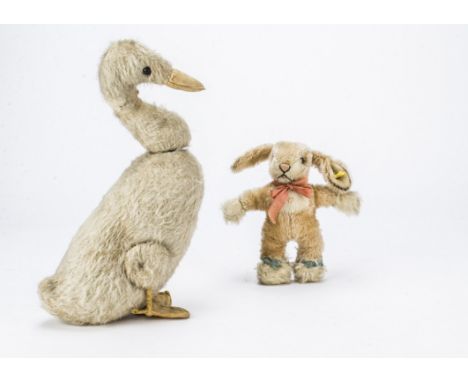 A rare Farnell Jemima Puddle-Duck 1910-20s, with white mohair, black boot button eyes, yellow cloth beak and webbed feet, joi