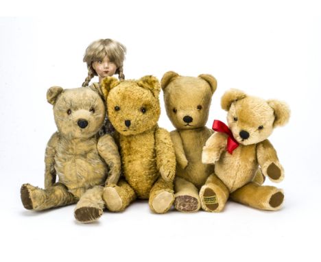 Four teddy bears, A worn Chiltern Hugmee with plastic nose —16in. (40.5cm.) high; a Pedigree musical bear; a cotton plush bea