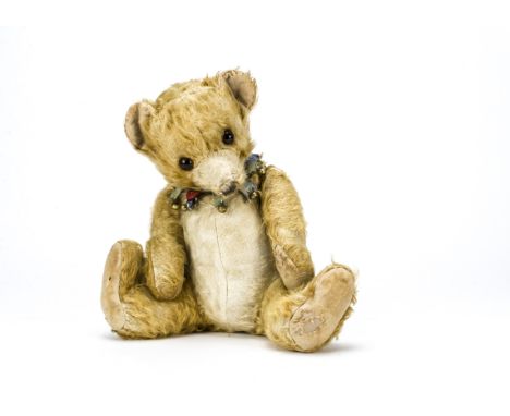 A Merrythought Bingie Baby teddy bear 1930s,  with light brown and white mohair, orange and black glass eyes, black stitched 