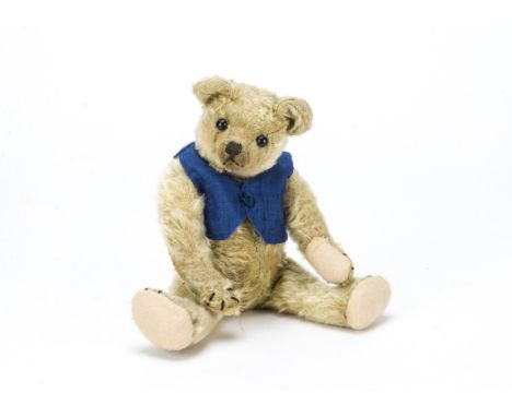 A small early Farnell teddy bear 1920s,  With blonde mohair, black boot button eyes, pronounced clipped muzzle, black stitche