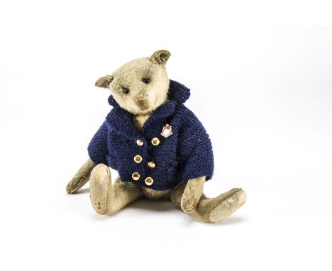 An early Steiff teddy bear circa 1909,  With white mohair, black boot button eyes, pronounced clipped muzzle, brown stitched 