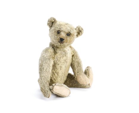 An early Steiff teddy bear circa 1909,  With blonde mohair, black boot button eyes, pronounced clipped muzzle, black stitched