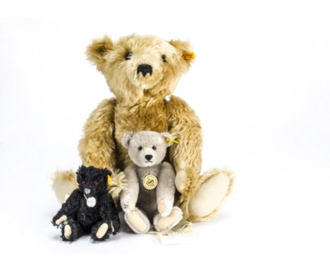 Three yellow tagged Steiff teddy bears, large 1930 Classic —21½in. (54.5cm.) high; 1905 Classic Richard Steiff; and Historic 