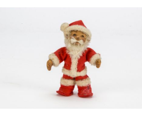 A rare Steiff post-war Father Christmas, With rubber face and hands, white mohair beard, red felt costume with white wool tri