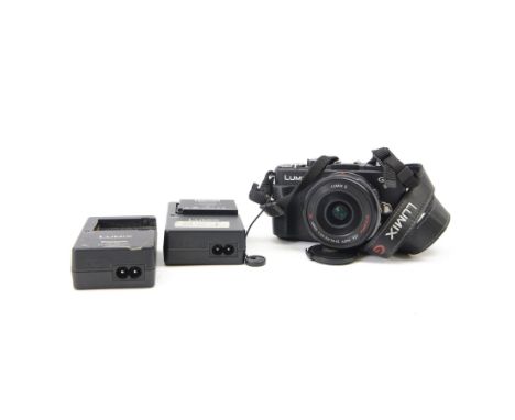 Panasonic Lumix DMC-GX1 digital camera serial no. FT2DA801057 with a Lumix G Vario 1:3.5 - 5.6/14-42 ASPH lens, with charger