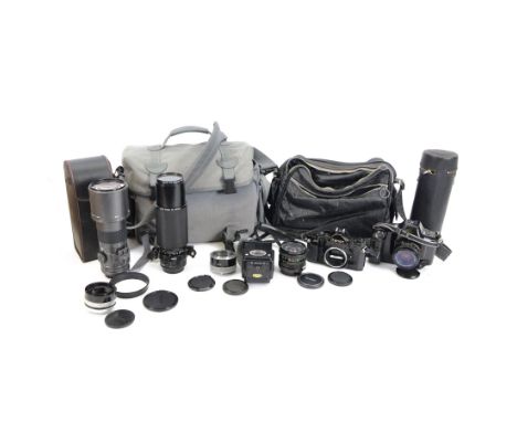 Two Canon SLR camera bodies, comprising Canon A-1 serial no. 718442 and Canon T90 serial no. 1195139, together with a Canon F