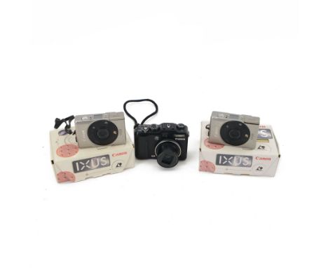 Two Canon Ixus IX240 compact digital cameras, both boxed, together with a Canon PowerShot G9 compact digital camera with a Ca