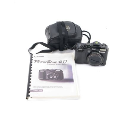 Canon PowerShot G11 digital camera serial no. 9015106423, in a soft shell case with user guide