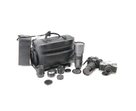 Two Minolta SLR camera bodies, comprising X-300 serial no. 8592491 and X-700 serial no. 1498583, together with five lenses in