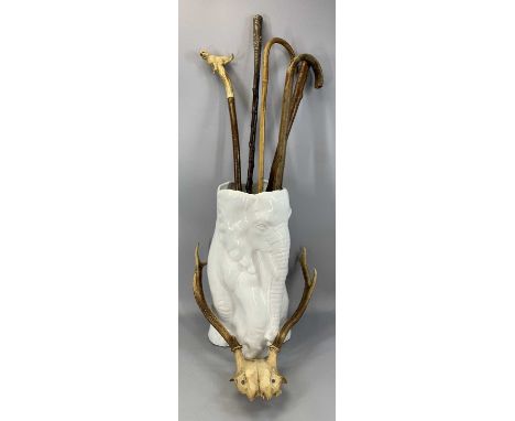 COLLECTION OF WALKING STICKS, pair of deer antlers with skull mount, contained in a large white glazed ceramic elephant stick