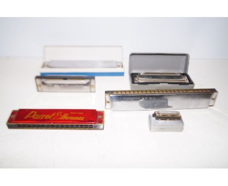 Group of vintage harmonicas to include a miniature harmonica