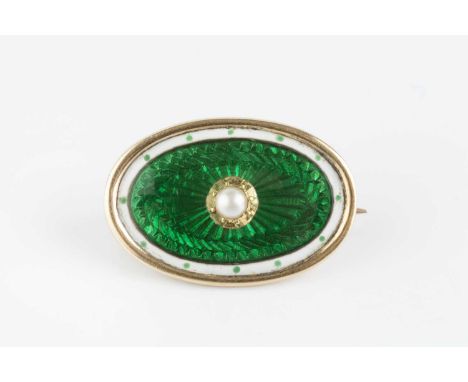 An Edwardian enamel and half pearl panel brooch, the oval panel centred with a half pearl accent, to a green and white enamel