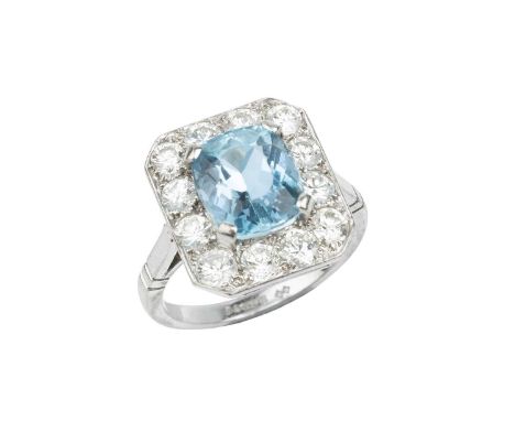 An aquamarine and diamond cluster ring, the cushion-shaped mixed-cut aquamarine claw set within an octagonal border of round 