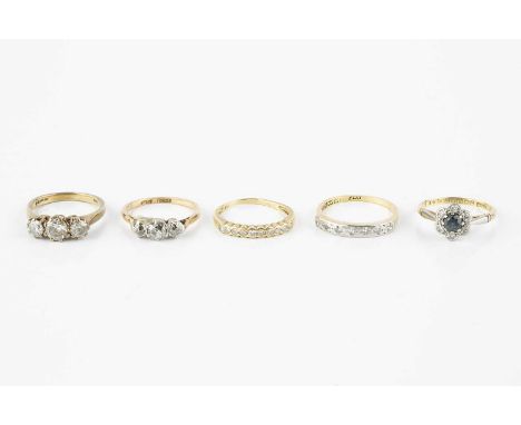 A collection of dress rings, comprising a diamond half hoop ring, set with circular-cut diamonds, 18ct gold mounted, a furthe